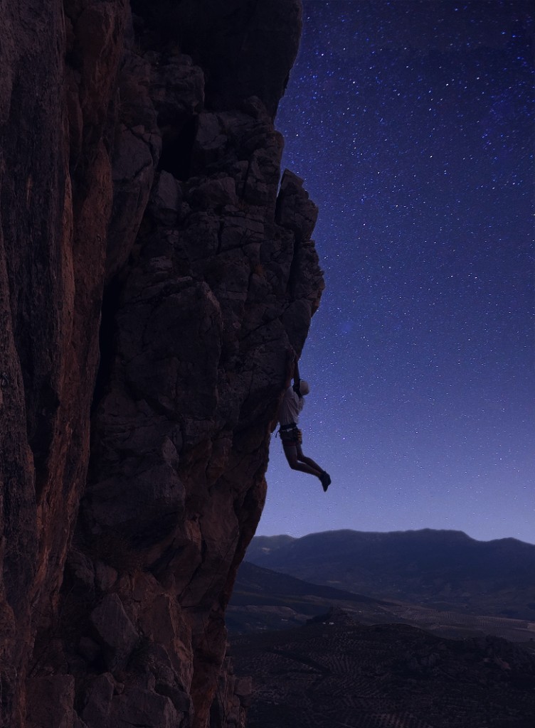 Climber on a mountain at night